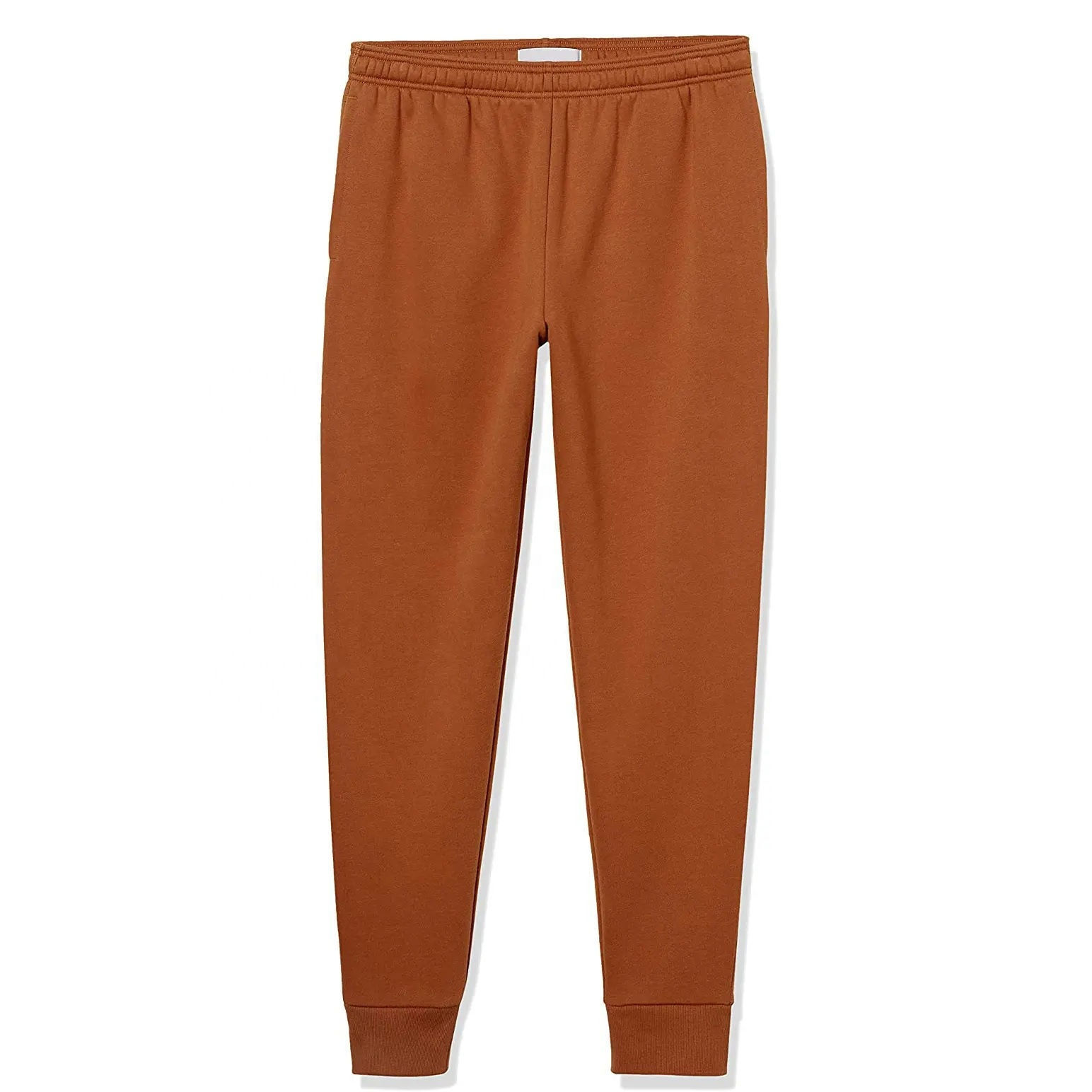 Rust-orange custom joggers with elastic waistband and cuffed ankles