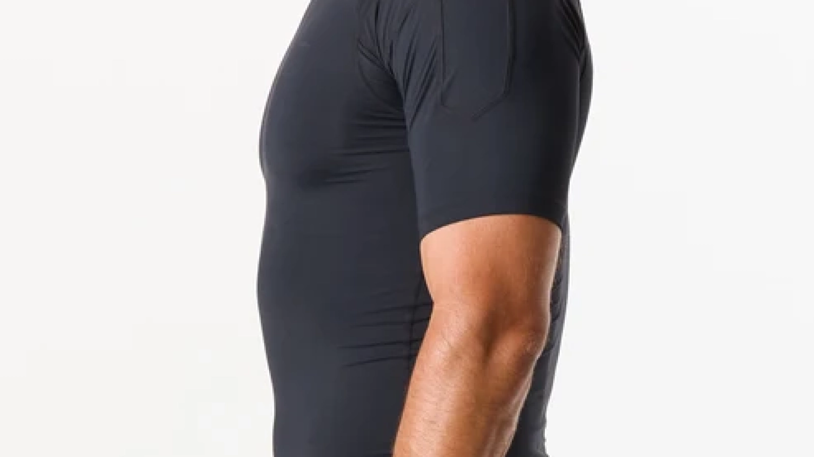 Black custom compression shirt with short sleeves and flatlock seams, worn by an athlete