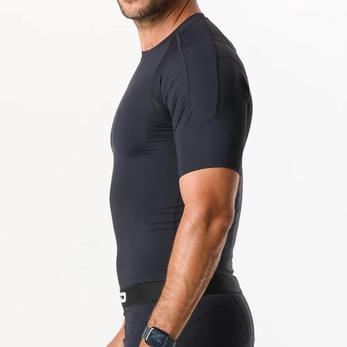 Black custom compression shirt with short sleeves and flatlock seams, worn by an athlete